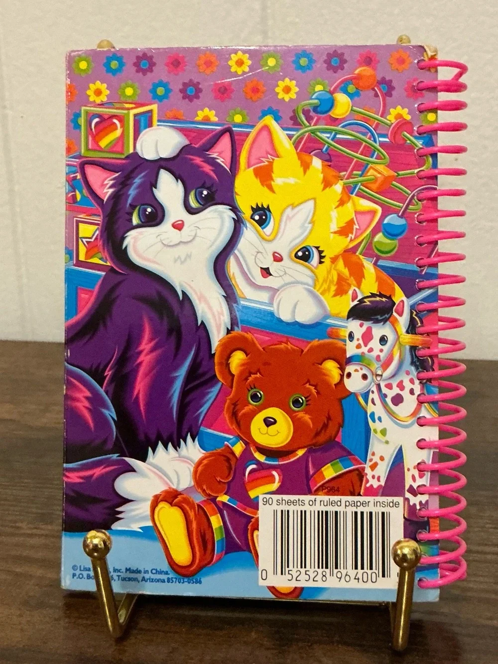 A vintage 1990s Lisa Frank snap mini notebook features colorful Playtime Kittens